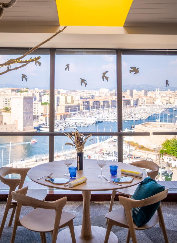 Restaurant Sofitel Oak Torsion dining tables and Oak Bok dining chairs | Live Light