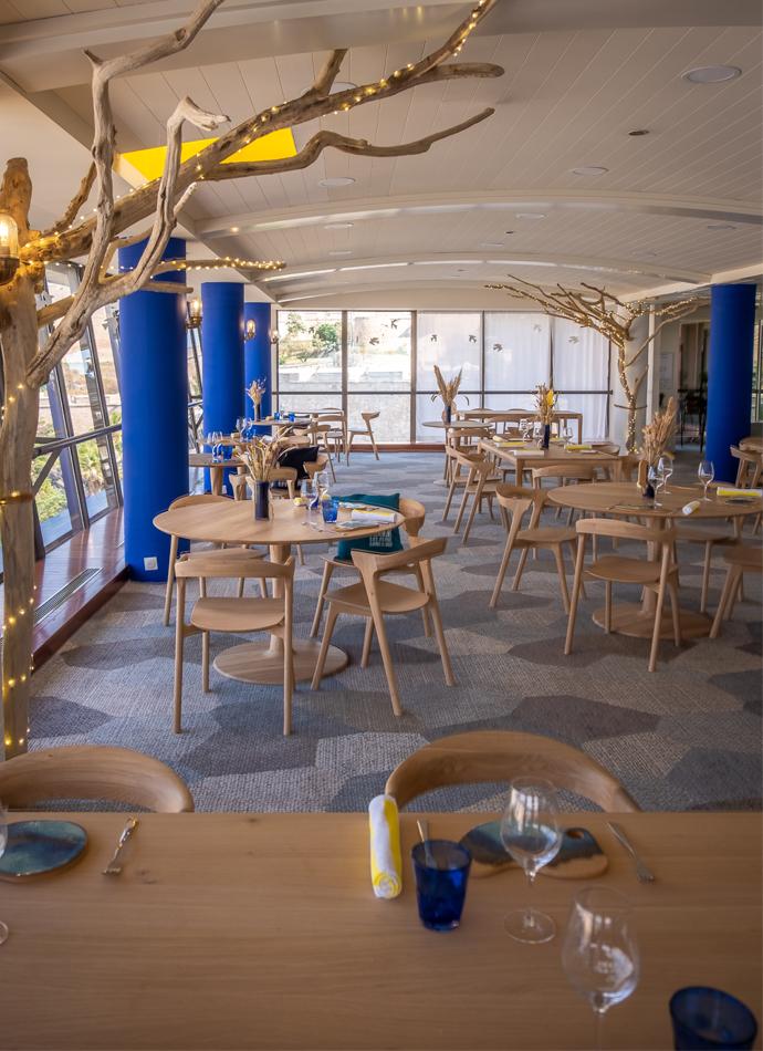 Restaurant Sofital Oak Torsion dining tables and Oak Bok dining chairs | Live Light