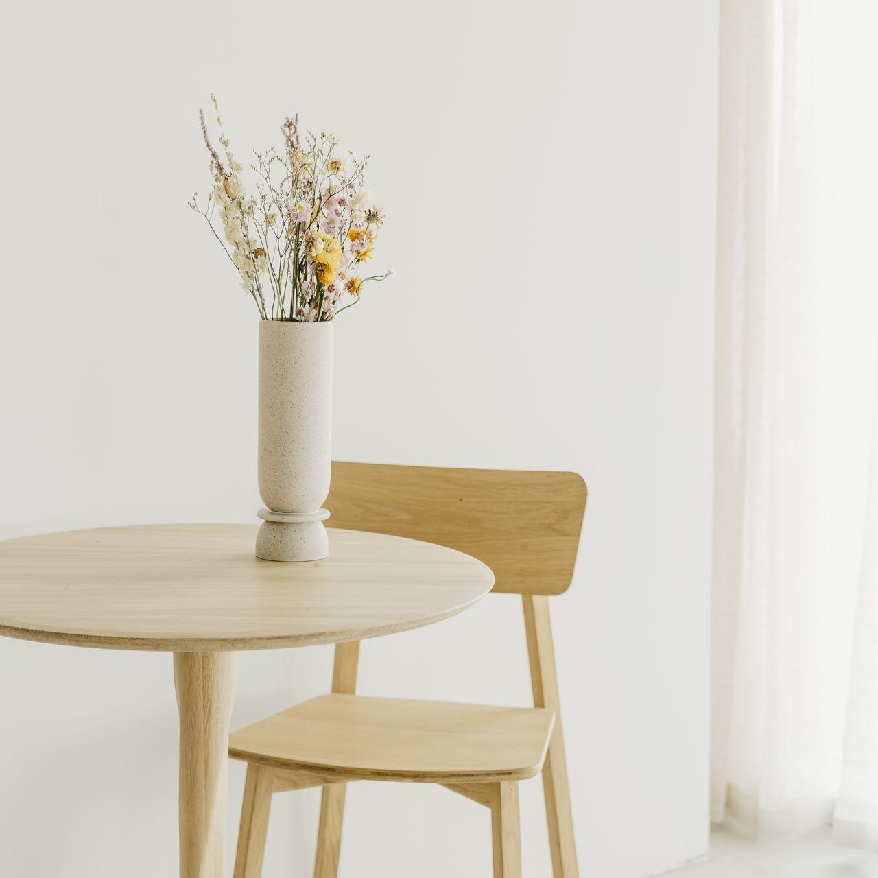 Oak Torsion dining table with flowers and Casale dining chair | Live Light